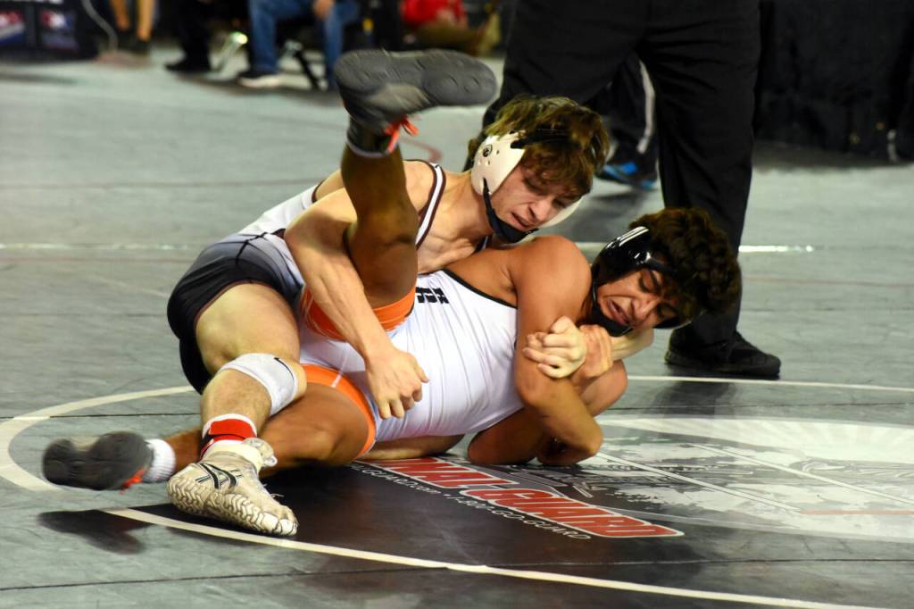 PHOTO BY SUE MICHALAK BUDSBERG Montesanos Cole Ekerson, left, competes at the Mat Classic XXXII state-championship tournament on Friday at the Tacoma Dome.