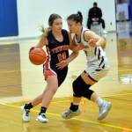 RYAN SPARKS | THE DAILY WORLD Montesano guard Vanna Prom, right, defends Tenino point guard Grace Vestal during the Bulldogs 38-35 victory in the 1A District 4 championship game on Saturday at Rochester High School.