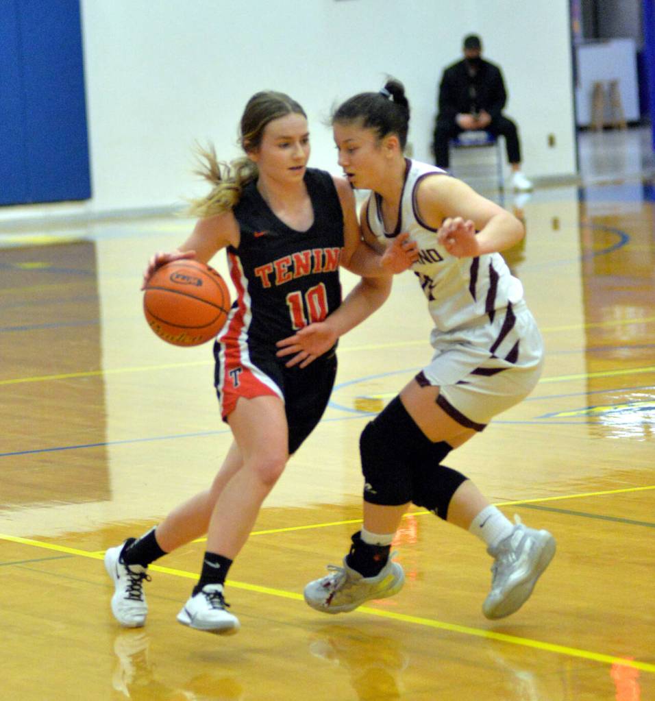 RYAN SPARKS | THE DAILY WORLD Montesano guard Vanna Prom, right, defends Tenino point guard Grace Vestal during the Bulldogs 38-35 victory in the 1A District 4 championship game on Saturday at Rochester High School.