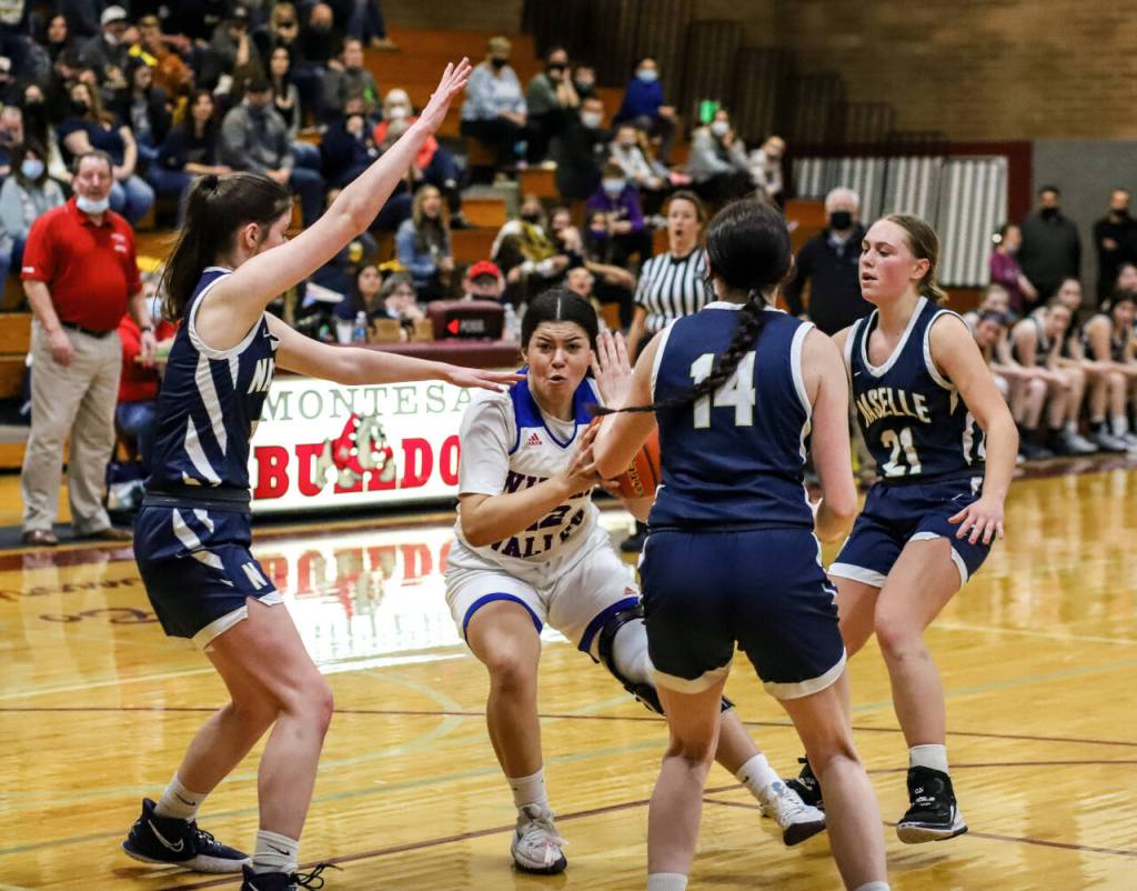 PHOTO BY LARRY BALE Willapa Valleys Lanissa Amacher, middle, is surrounded by the Naselle defense during the Vikings 33-24 loss on Saturday at Montesano High School.