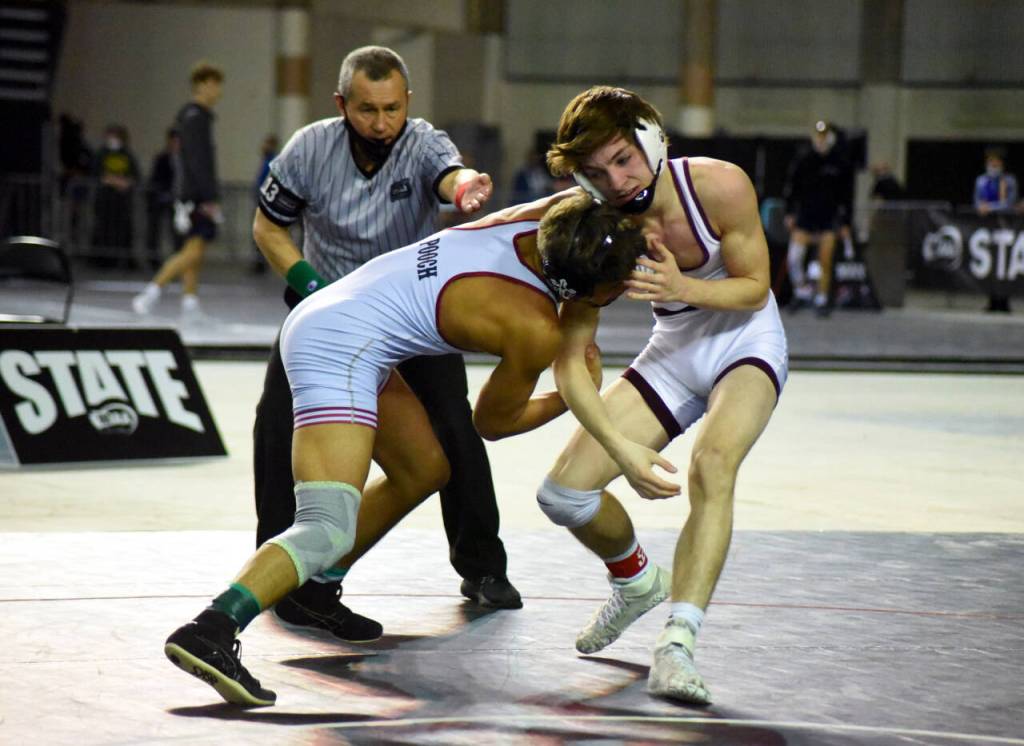 PHOTO BY SUE MICHALAK BUDSBERG Montesanos Cole Ekerson, right, grapples with Toppenishs Marcos Torrez in the 1A 132 pound state-championship match on Saturday at the Mat Classic XXXIII meet in Tacoma.