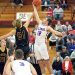 RYAN SPARKS | THE DAILY WORLD Willapa Valley senior Gavin Hampton (12) wins the opening tip-off against Sunnyside Christians Cole Wagenaar during the Vikings 65-59 victory in a 1B Regional round game on Saturday at WF West High School in Chehalis.