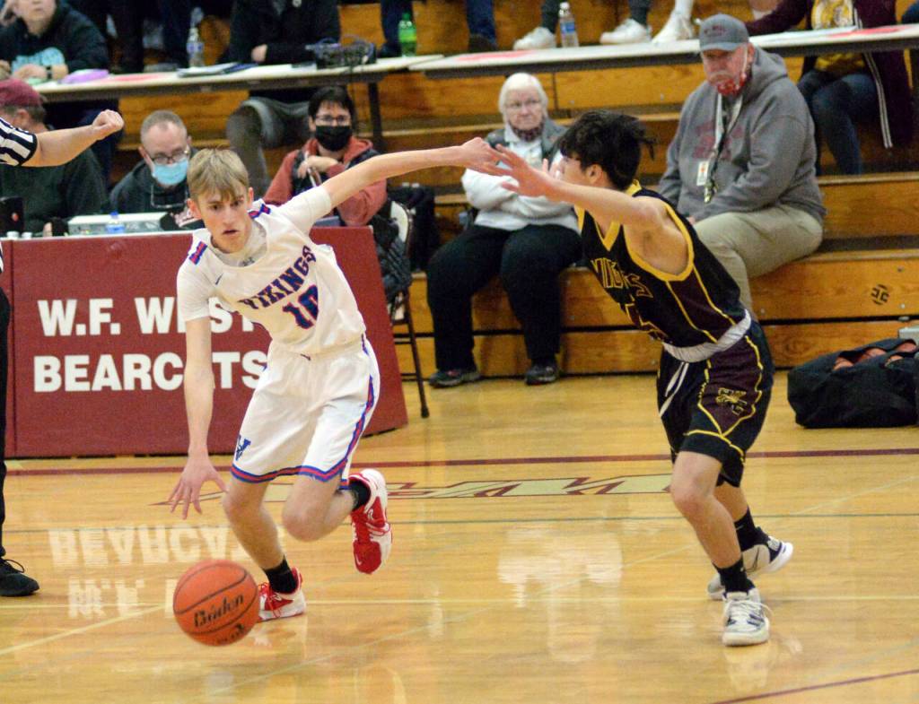 RYAN SPARKS | THE DAILY WORLD Willapa Valley guard Riley Pearson (10) is defended by Sunnyside Christians Jaden Jech during the Vikings 65-59 victory in a 1B Regional round game on Saturday at WF West High School in Chehalis.