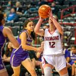 ERIC TRENT | THE CHRONICLE Raymond guard Kyndal Koski (12) looks to shoot against Mabton defenders Keirrah Roettger (10) and Mari Galarza during Raymonds 65-44 victory in the first round of the 2B State Tournament on Wednesday, March 2, 2022 at the Spokane Arena.