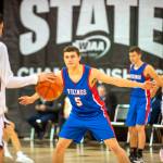 ERIC TRENT | THE CHRONICLE Willapa Valleys Wil Clements (5) stares down Lummi Nations Duncan Toby during the Vikings 65-59 loss in a 1B State Boys Basketball Tournament elimination game on Friday at the Spokane Arena.
