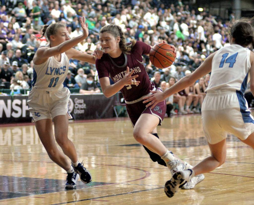 RYAN SPARKS | THE DAILY WORLD Montesano junior McKynnlie Dalan (34) drives to the basket against Lynden Christians Lexi Kaptein during the Bulldogs 57-32 loss in the 1A State Tournament semifinals on Friday in Yakima.