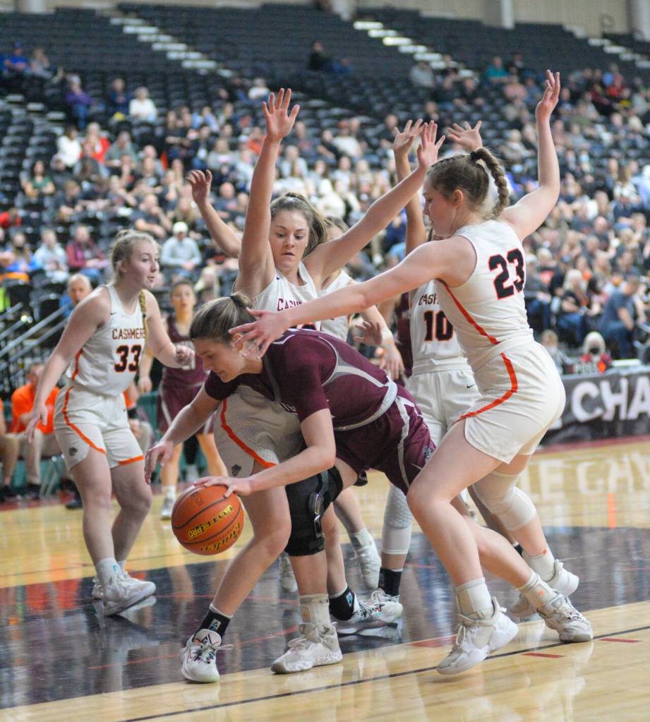 RYAN SPARKS | THE DAILY WORLD Montesano junior McKynnlie Dalan, center, is surrounded by a trio of Cashmere defenders during the Bulldogs 41-33 loss in the 1A State third/fifth-place game on Saturday in Yakima.
