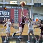RYAN SPARKS | THE DAILY WORLD Montesano senior Paige Lisherness (23) scores against Cashmeres Ellie Bessonette (21) during the Bulldogs 41-33 loss in the 1A State third/fifth-place game on Saturday in Yakima.