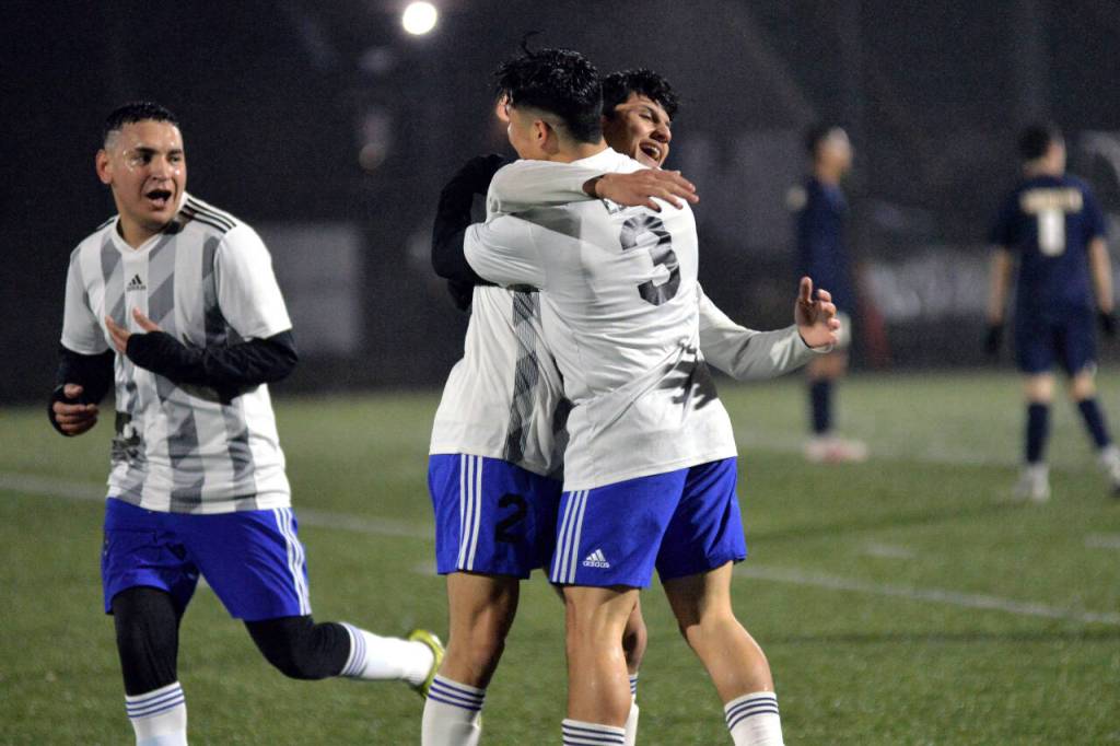 RYAN SPARKS | THE DAILY WORLD Elma forward Manny Hernandez (3) celebrates with teammates René Duran (2) and Valencia Mendoza after scoring a goal early in the first half against Aberdeen on Saturday in Aberdeen.