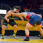JIM THRALL | MATFOCUS.COM Grays Harbor College wrestler Sione Halo, left, grapples with Libertys Josiah Murphy in the 197 pound title match at the NCWA National Championships on Saturday in Allen, Texas.