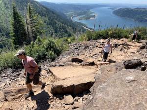 Mark Morical | The Bend Bulletin | TNS | File Photo
Tony Barnes and Cindy Morical, both of Vancouver, Washington, hike along the Angels Rest Trail in the Columbia River Gorge on July 5, 2021.