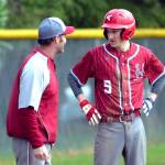 RYAN SPARKS | THE DAILY WORLD Hoquiam head coach Steve Jump talks with Grizzlies outfielder Chase Schumate after Schumate drove in a run with a double in a loss to Montesano on Monday at Vessey Field in Montesano.
