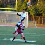 RYAN SPARKS | THE DAILY WORLD Elma defender Ivan Garcia leaps over Montesanos Felix Romero (13) for a header during Elmas 3-1 win on Wednesday in Montesano.