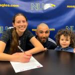 SUBMITTED PHOTO Aberdeen High School goal keeper Char Gutierrez, left, signed a National Letter of Intent on March 31 to attend Northwest University in Kirkland in the fall. Gutierrez is pictured with her father, Anthony, and sister, Maze.