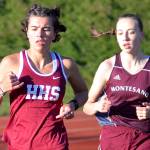 RYAN SPARKS | THE DAILY WORLD Hoquiams Jane Roloff, left, leads Montesanos Samantha Schweppe in the girls 1600 meter race during the Ray Ryan Memorial Grays Harbor Championships on Friday in Montesano.