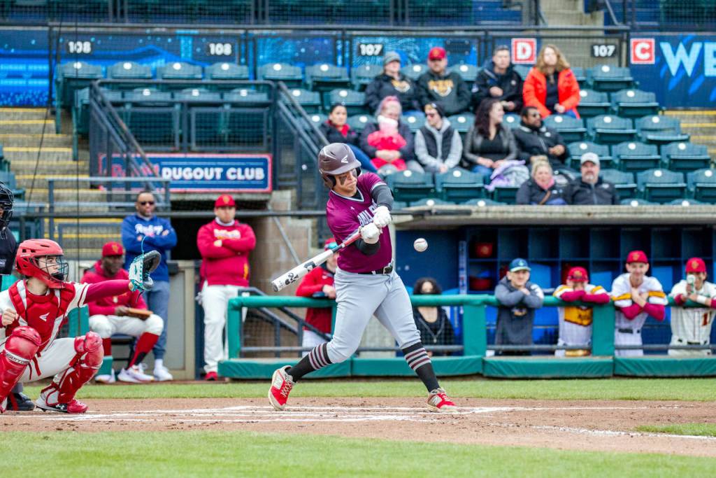 PHOTO BY SHAWN DONNELLY Montesanos Isaiah Pierce connects on a pitch during the Bulldogs 9-5 loss to Jefferson on Saturday at Cheney Stadium in Tacoma.