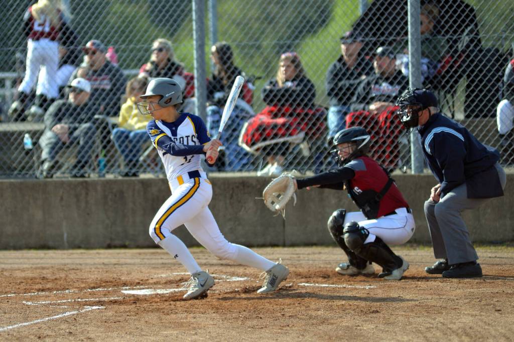 RYAN SPARKS | THE DAILY WORLD Aberdeen third baseman Maddie Gore smacks a base hit during the Bobcats 5-3 win over WF West on Wednesday in Aberdeen.