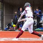 PHOTO BY SHAWN DONNELLY Montesano senior Paige Lisherness (8) hits a grand slam home run in the seventh inning in a 10-5 win over Eatonville on Friday in Montesano.