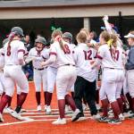 PHOTO BY SHAWN DONNELLY Montesano senior Paige Lisherness (8) celebrates with her teammates after hitting a grand slam home run in the seventh inning in a 10-5 win over Eatonville on Friday in Montesano.