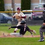 RYAN SPARKS | THE DAILY WORLD Montesano infielder Bode Poler (4) looks to turn a double play as Teninos Kaden Sayamnet slides in during Montes 11-4 victory over Tenino on Wednesday in Montesano.