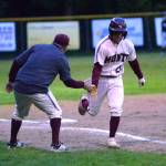 RYAN SPARKS | THE DAILY WORLD 
Montesano third baseman Isaac Pierce gets a low-five from head coach Mike Osgood after belting a solo home run in the fifth inning of the Bulldogs 11-4 victory over Tenino on Wednesday, May 4, 2022, at Vessey Field in Montesano.