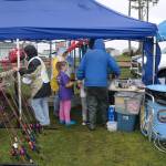The Mark Swanson 12th Annual Ocean Shores Elks Youth Fishing Derby brought children and their families to Duck Lake on Saturday, May 7 despite poor weather conditions. Registration was free and participants were able to fish from a well-stocked lake while enjoying food, merchandise, and fish cleaning services. Erika Gebhardt I The Daily World