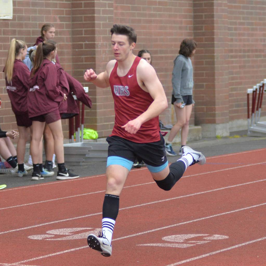 RYAN SPARKS | THE DAILY WORLD Hoquiams Timmy Higgins pumps his fist as he crossed the finish line to win the boys 400 at the 1A Evergreen Sub-District Championships on Friday in Montesano.