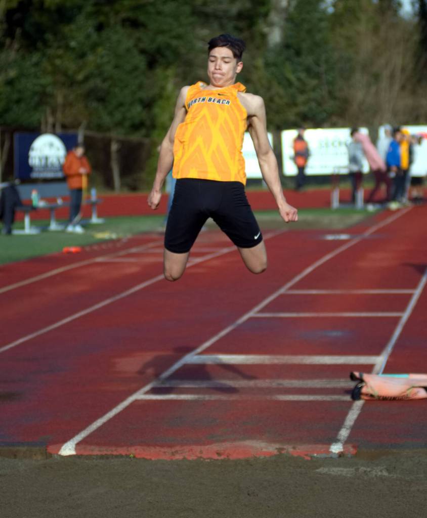 DAILY WORLD FILE PHOTO North Beach senior Josh Bighead, seen here in a file photo, won the boys long jump to help the Hyaks win the team title at the Pacific League Championships on Friday in Raymond.