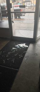 Courtesy Photo 
David Gleaves, owner of Deen Dogs, had to call his landlord to get his glass door fixed after a vandal punched the front door to his business on the evening of April 20, 2022. Gleaves said it took about a week to replace the glass, largely because of the frame and the type of glass used.