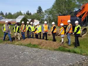 Allen Leister | The Daily World 
Grays Harbor College board members and facility staff pose for the celebratory groundbreaking ceremony to kick off the beginning of the Student Services & Instruction Building construction on May 17, 2022, at Grays Harbor College in Aberdeen.