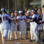 RYAN SPARKS | THE DAILY WORLD The Pe Ell-Willapa Valley Titans await the arrival of Olivia Matlock (19) at home plate after Matlock smashed her second home run of the game in an 11-1 win over Onalaska in the 2B District 4 semifinals on Friday in Centralia.