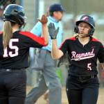 RYAN SPARKS | THE DAILY WORLD Raymonds Callie McVey (5) is congratulated by teammate Candence Swogger after scoring a run in the Seagulls 11-9 loss to Toledo in the 2B District 4 Tournament on Friday in Centralia.