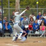 RYAN SPARKS | THE DAILY WORLD Pe Ell-Willapa Valleys Dani Shannon, right, slides in safe at home while Adna catcher Brooklyn Loose defends during the Titans 14-13 loss in the 2B District 4 Tournament championship game on Saturday at Fort Borst Park in Centralia.