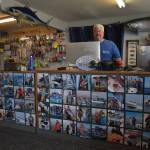 Eric McMurry, owner of Ocean Sportfishing Charters, stands behind a counter that features all local catches from past years in and around Westport. The Westport community is learning to integrate traditional industry into its tourism offerings to create unique and authentic experiences in Grays Harbor. Matthew N. Wells | The Daily World