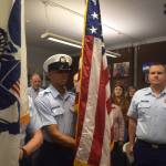 Matthew N. Wells | The Daily World 
U.S. Coast Guard Seaman Ocasio Rodriguez, of the Coast Guard Honor Guard, carefully transports the U.S. Flag in front of Master Chief Shane Caroll, Command Master Chief for the Coast Guards 13th District, during a Colors presentation on Saturday, May 28, 2022, at the city of Westports Coast Guard City Designation Ceremony inside Westport Maritime Museums McCausland Hall.