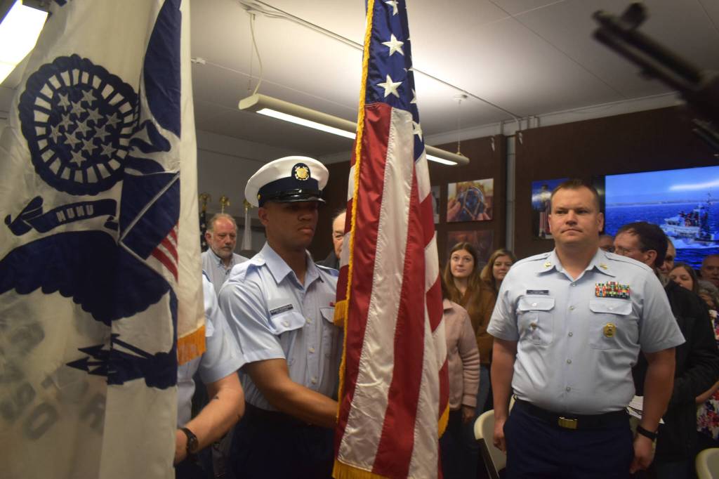 Matthew N. Wells | The Daily World 
U.S. Coast Guard Seaman Ocasio Rodriguez, of the Coast Guard Honor Guard, carefully transports the U.S. Flag in front of Master Chief Shane Caroll, Command Master Chief for the Coast Guards 13th District, during a Colors presentation on Saturday, May 28, 2022, at the city of Westports Coast Guard City Designation Ceremony inside Westport Maritime Museums McCausland Hall.