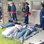 The Daily World | File Photos 
In an active shooter drill from April 28, 2018, victims are laid outside the 200 Building at Grays Harbor College. Deceased victims are placed with their arms crossed over their chests so medical personnel know to attend to other victims.