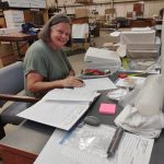 Aberdeen City Council member Deborah Ross, who holds an appointed position on the museum board, assists with archiving efforts in the warehouse where the collection is being stored. The city is eager to move the collection to the new museum location they purchased in February, but will first need to renovate the building in order to ensure safety. Photo courtesy of John Shaw