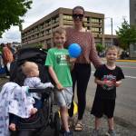 Connie Jensen, her 7-year-old son Tommy, 5-year-old son Travis, and her 11-month-old daughter Karlie, enjoyed the multiple cheerleader routines, the Jeeps, and the motorcycles that passed by during the Aberdeen Founders Day parade on Saturday, July 2, 2022, in downtown Aberdeen. (Matthew N. Wells | The Daily World)