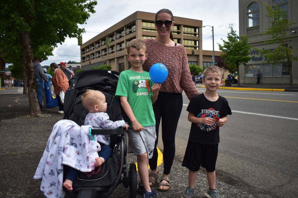 Connie Jensen, her 7-year-old son Tommy, 5-year-old son Travis, and her 11-month-old daughter Karlie, enjoyed the multiple cheerleader routines, the Jeeps, and the motorcycles that passed by during the Aberdeen Founders Day parade on Saturday, July 2, 2022, in downtown Aberdeen. (Matthew N. Wells | The Daily World)