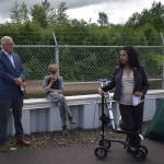 Governor Jay Inslee (left) listens, alongside his grandson Brody, to Mayor Vini Samuel of Montesano (right) as she describes the work done to prevent flooding and erosion from causing a potential ecological disaster at the Montesano Wastewater Treatment Plant on July 7, 2022. (Allen Leister | The Daily World)