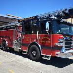 Eric Brooks, probationary firefighter and paramedic for Aberdeen Fire Department, stands by fire engine No. 10, on Tuesday, July 19, at the firehouse. (Matthew N. Wells | The Daily World)