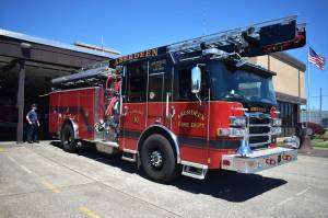 Eric Brooks, probationary firefighter and paramedic for Aberdeen Fire Department, stands by fire engine No. 10, on Tuesday, July 19, at the firehouse. (Matthew N. Wells | The Daily World)