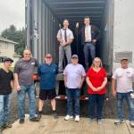 Photo Courtesy of Miriam Jones
Volunteers from The Church of Jesus Christ of Latter-day Saints and the North Beach Senior Center of Ocean Shores (NBSC,) pose for a photo on Wednesday morning, Aug. 3, 2022, after delivering 40,000 pounds of nonperishable items to NBSCs doorstep. The items, including peanut butter, spaghetti and spaghetti sauce, macaroni and cheese, pork and beans, plus laundry detergent and dish soap, will help thousands of Grays Harbor County residents, as well as residents outside of the county.