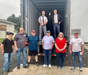 Photo Courtesy of Miriam Jones
Volunteers from The Church of Jesus Christ of Latter-day Saints and the North Beach Senior Center of Ocean Shores (NBSC,) pose for a photo on Wednesday morning, Aug. 3, 2022, after delivering 40,000 pounds of nonperishable items to NBSCs doorstep. The items, including peanut butter, spaghetti and spaghetti sauce, macaroni and cheese, pork and beans, plus laundry detergent and dish soap, will help thousands of Grays Harbor County residents, as well as residents outside of the county.