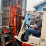 Photo Courtesy of Miriam Jones
Jeff Moyer, executive director for North Beach Senior Center of Ocean Shores, drives a forklift on Wednesday morning, Aug. 3, 2022, in order to help transport 40,000 pounds of nonperishable items that came 900 miles from The Church of Jesus Christ of Latter-day Saints in Salt Lake City, Utah.