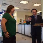 Matthew N. Wells | The Daily World 
United States Postal Services Manager of Post Office Operations Hugo Vo, right, celebrates Mellissa Cotys promotion to postmaster of the Westport Post Office on Tuesday morning, Aug. 16, 2022. Coty, 30, is the youngest person appointed to the postmaster position at the Westport office.