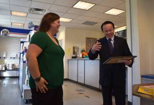 Matthew N. Wells | The Daily World 
United States Postal Services Manager of Post Office Operations Hugo Vo, right, celebrates Mellissa Cotys promotion to postmaster of the Westport Post Office on Tuesday morning, Aug. 16, 2022. Coty, 30, is the youngest person appointed to the postmaster position at the Westport office.