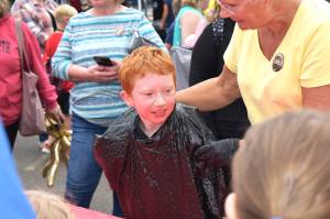 Photos by Matthew N. Wells | The Daily World
Joseph Gifford, who won SummerFest 2022s watermelon challenge in the 9- to 11-year-old category, celebrates his win on Saturday, Aug. 20, 2022, as the juice falls off his face. Gifford won a $10 Pizza Hut gift card, and he talked about his close victory. I was in first place, but someone was right behind me, Joseph said.