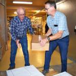 Matthew N. Wells | The Daily World
Erv Granahan, left, and Greg Johnstone help load frozen food into the freezer on Tuesday morning, Aug. 23, 2022, at the Salvation Army Food Distribution Center in Aberdeen. The center is located at 120 W. Wishkah St. People in need of food, or any other service, can call 360-533-1062. People without phone service can knock on the door for help.